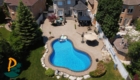 Aerial Drone Shot Of Pool At Back Of House